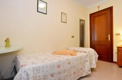 Letto o letti in una camera di B&B Il Pavone