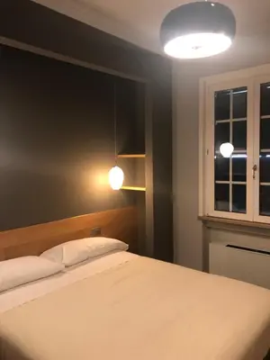 Letto o letti in una camera di Albergo Tre Pozzi