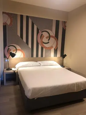 Letto o letti in una camera di Albergo Tre Pozzi