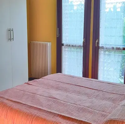 Letto o letti in una camera di Confortevole appartamento a Reggio Emilia