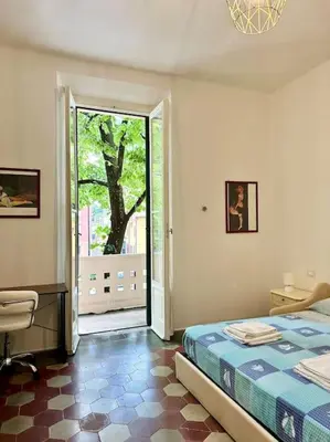 Letto o letti in una camera di Appartamento liberty Vittoria