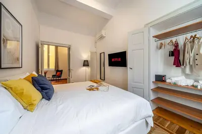Letto o letti in una camera di Dehor in pieno centro - Piazza XX Settembre