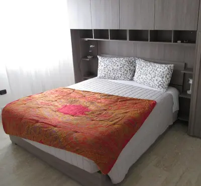 Letto o letti in una camera di casa dei ragazzi