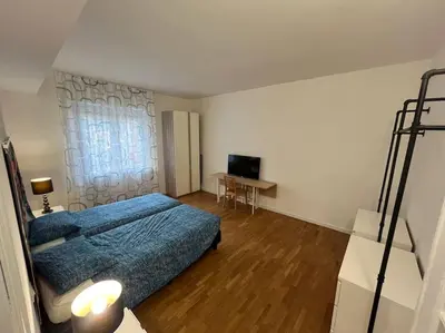 Letto o letti in una camera di Appartamento spazioso in centro