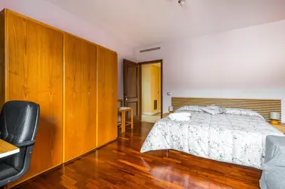 Letto o letti in una camera di Suite con Bagno a Carpi Wi-Fi & Smart tv