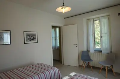 Letto o letti in una camera di La Foresteria della Beppa