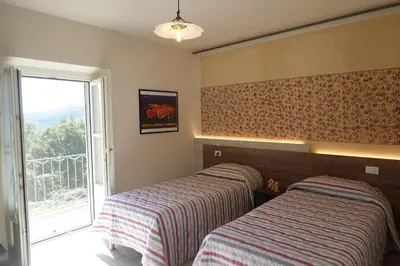 Letto o letti in una camera di La Foresteria della Beppa