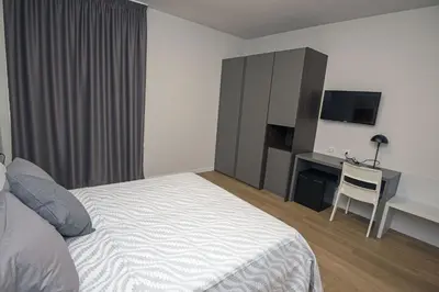 Letto o letti in una camera di Franciacorta Karting Rooms