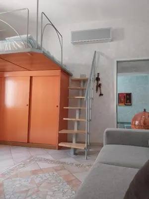 Letto o letti in una camera di Appartamento centro storico davanti al Duomo di Pavia