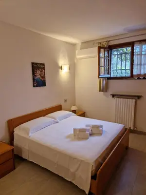 Letto o letti in una camera di Villa Angelica