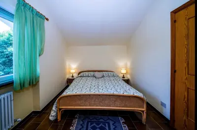 Letto o letti in una camera di Villa La Pianazza - un OASI nel verde con piscina a pochi minuti da Sestri Levante