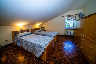 Letto o letti in una camera di Villa La Pianazza - un OASI nel verde con piscina a pochi minuti da Sestri Levante