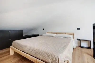 Letto o letti in una camera di Attico in centro vista mare