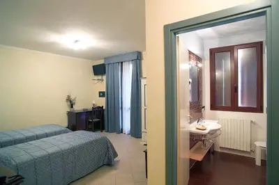 Letto o letti in una camera di Hotel del Rio Srl - RISTORANTE e Azienda agricola