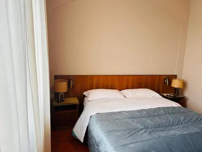 Letto o letti in una camera di Hotel Business