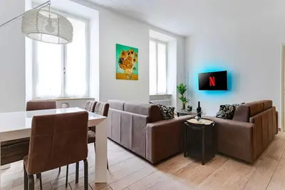 Area soggiorno di RELAX - Historic Center with 3 Bedrooms and Free ZTL Pass