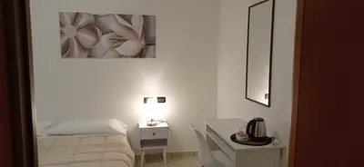 Letto o letti in una camera di Hotel IL Rifugio