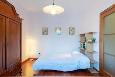 Letto o letti in una camera di GuestHost - Parma Cozy Studio near the Hospital