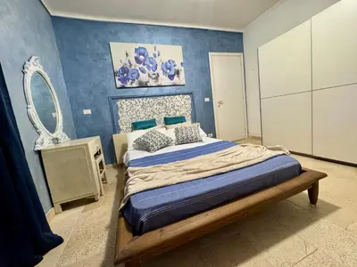 Letto o letti in una camera di Villa San Cataldo primo piano