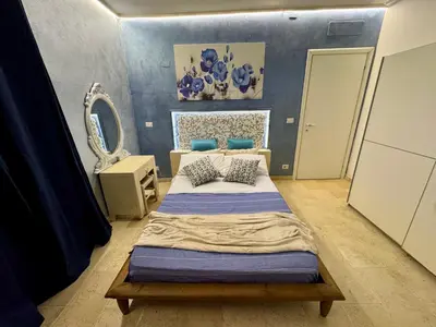 Letto o letti in una camera di Villa San Cataldo primo piano