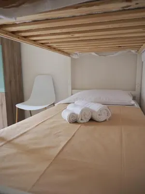 Letto o letti in una camera di Bilocale moderno centro Mantova