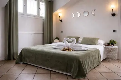 Letto o letti in una camera di Attico elegante con terrazza panoramica, in centro