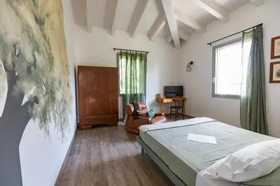 Letto o letti in una camera di Saranto, Maison du Charme - La Tua Oasi nel Verde dell'Emilia