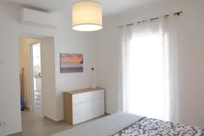 Letto o letti in una camera di Riva Ponente