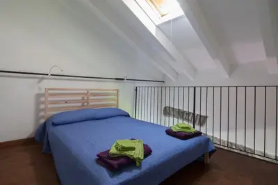 Letto o letti in una camera di appartamento in casa medievale