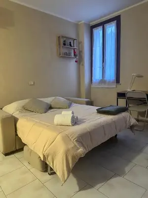 Letto o letti in una camera di Nocciolino Home