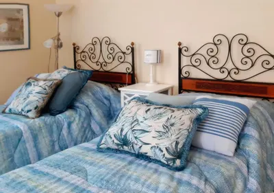 Letto o letti in una camera di Villa Adele