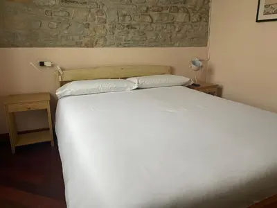 Letto o letti in una camera di Torre dei Magnani