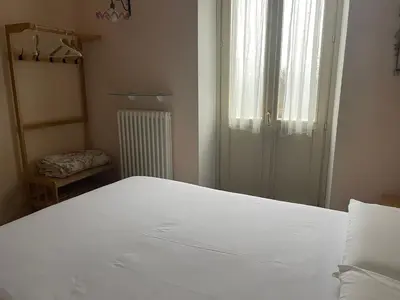 Letto o letti in una camera di Torre dei Magnani