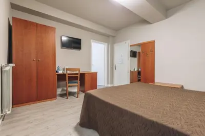 Letto o letti in una camera di Hotel Astoria