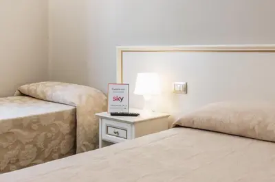 Letto o letti in una camera di Hotel Astoria