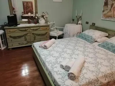 Letto o letti in una camera di B&B La Casa di Rita