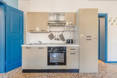 Cucina o angolo cottura di Dolcevita PentHouse - A due passi dalla Ghirlandina