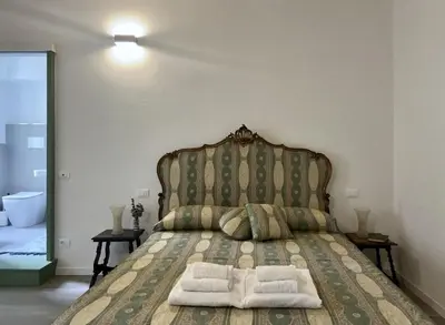 Letto o letti in una camera di Inn Borromeo - Pavia City - by HOST4U