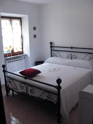 Letto o letti in una camera di Agriturismo Il Giglio e la Rosa
