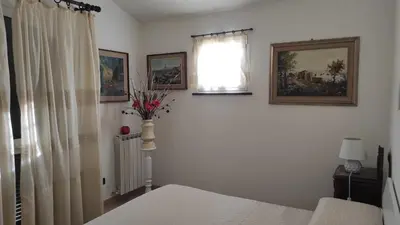 Letto o letti in una camera di Villino Isabella