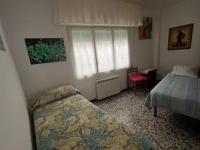 Letto o letti in una camera di Piano terra con giardino