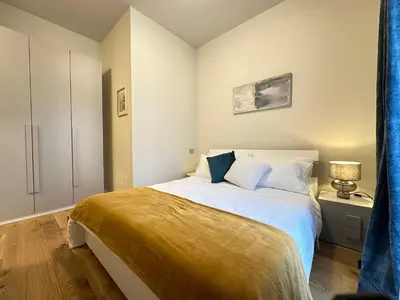 Letto o letti in una camera di Bilocale Savoia parcheggio gratuito