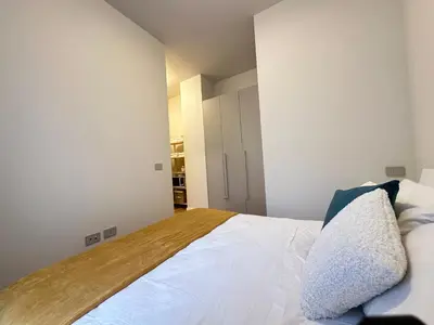 Letto o letti in una camera di Bilocale Savoia parcheggio gratuito