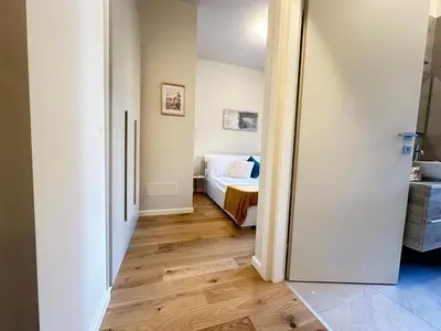 Letto o letti in una camera di Bilocale Savoia parcheggio gratuito