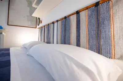 Letto o letti in una camera di 274b- Casa delle Due Baie, 10 minuti a piedi dalla Baia del Silenzio e dal Centro Storico