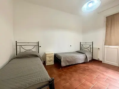 Letto o letti in una camera di Casa del fiorista