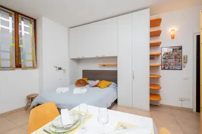 Letto o letti in una camera di La Casa sui Tetti - Appartamento vista Duomo di Pavia