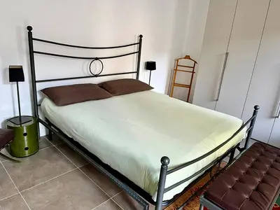 Letto o letti in una camera di Casa Santina - Palazzo Trecchi-Università
