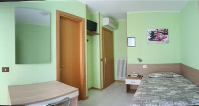 Letto o letti in una camera di Albergo Esperia