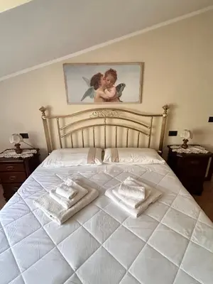Letto o letti in una camera di La Fabiola